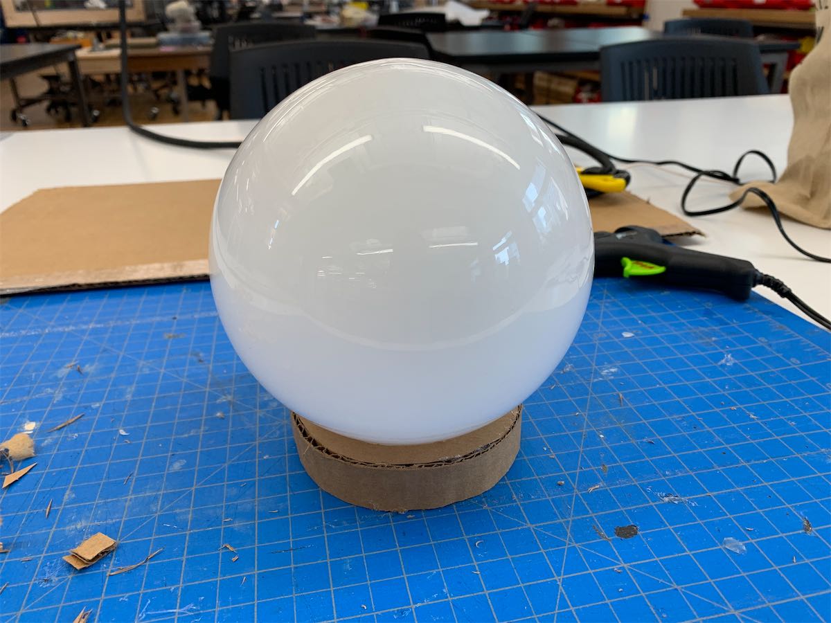glass globe shade with a cardboard base